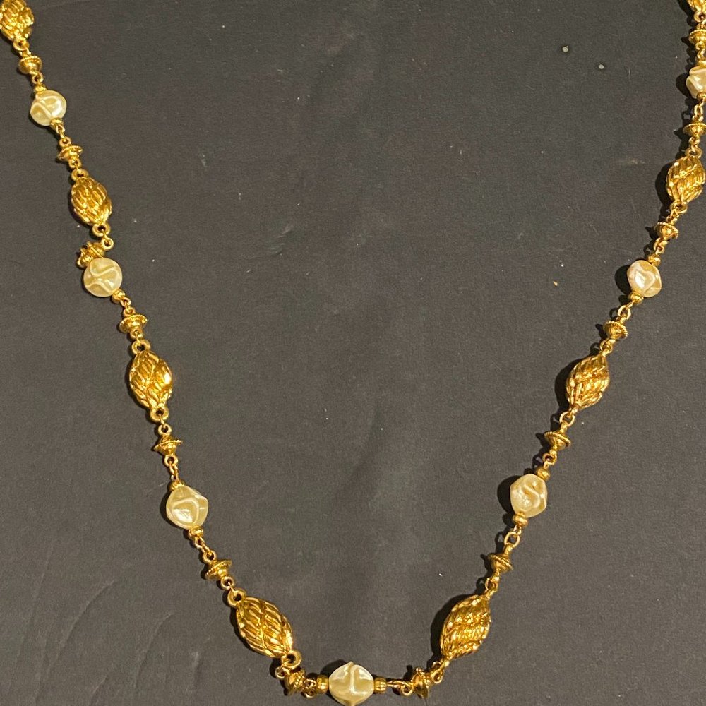 Costume metal and pearl strand necklace